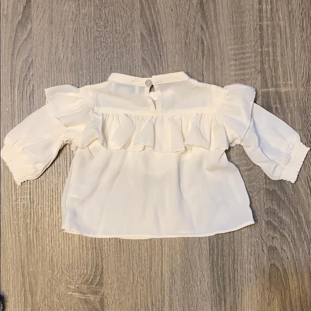 Off white ruffle top blouse